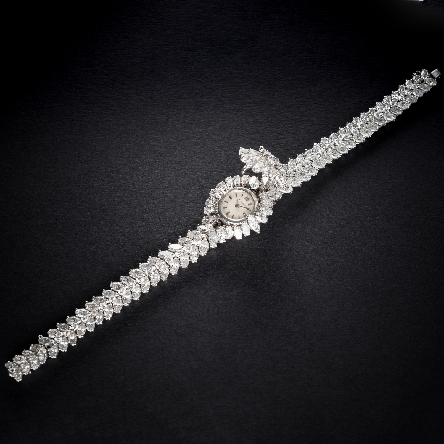 A FINE & RARE LADIES PLATINUM & DIAMOND BLANCPAIN BRACELET WATCH CIRCA 1950s D: Silver dial with