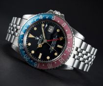 A GENTLEMAN'S STAINLESS STEEL ROLEX OYSTER PERPETUAL GMT MASTER BRACELET WATCH CIRCA 1979, REF.