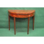 Georgian mahogany demi lune card table having cross banded top opening to reveal green baized