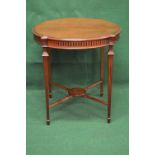 Mahogany circular occasional table the top having moulded edge over a reeded frieze,