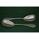 Pair of Victorian heavy gauge serving spoons with formal engraved decoration and original family