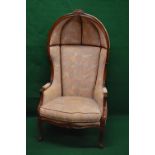 Late 20th century mahogany effect stained beech porters chair having floral carved finial over