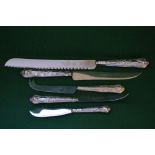 Five Kings pattern silver handled flatware items to comprise: bread knife, cake knife, cheese knife,