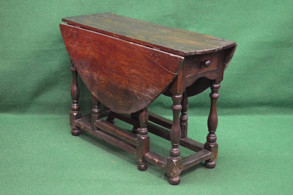 Period oak gateleg table having bow ends and two drop leaves over single drawer with turned wooden