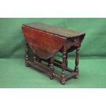 Period oak gateleg table having bow ends and two drop leaves over single drawer with turned wooden