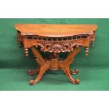 Late 20th century carved demi lune side table having shaped top with moulded edge over a carved