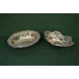 Two silver pierced bon bon dishes of oval form with shaped borders,