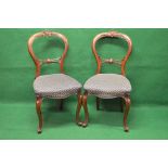 Set of six balloon back chairs having carved top and back rails over padded seats,