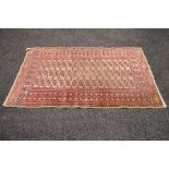 Beige ground rug having red, black and orange pattern - 61.5" x 36.