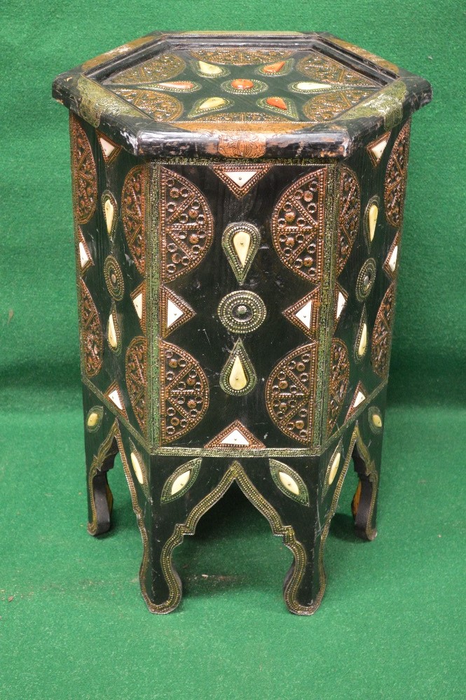 Copy of an Eastern occasional table of octagonal shape and being decorated with embossed metal