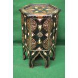 Copy of an Eastern occasional table of octagonal shape and being decorated with embossed metal