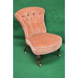 Victorian button back nursing chair having shaped back over upholstered padded shaped seat with bow