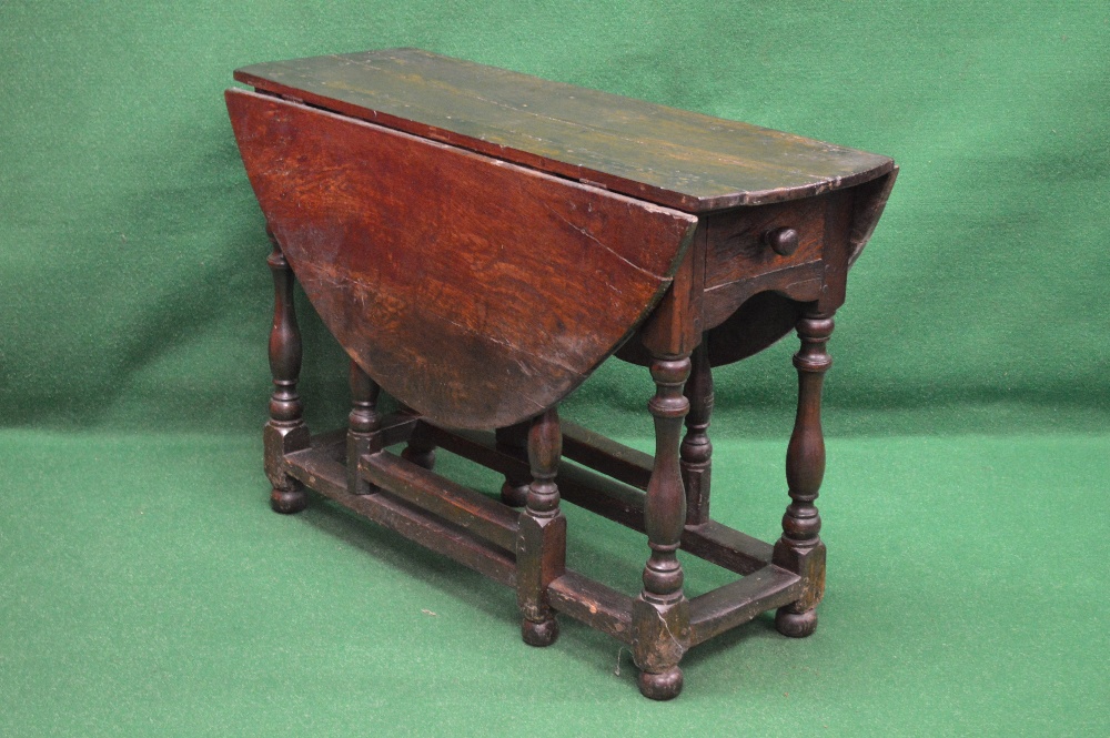 Period oak gateleg table having bow ends and two drop leaves over single drawer with turned wooden - Image 2 of 2