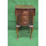 Mahogany drop flap side cabinet having two drop flaps and shaped front over single drawer and