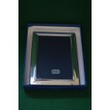 Plain rectangular silver photograph frame by Richard Carr,