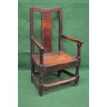 Period oak elbow chair having vertical back splat and moulded uprights,