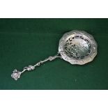 Highly decorative silver serving spoon with fine quality cast and pierced decoration,