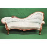 Victorian walnut framed chaise longue having carved show wood frame and buttoned back upholstery