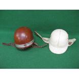 Two vintage cork motorcycle helmets to comprise: a peaked Corker by J Compton Sons & Webb Ltd and a