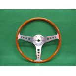 Slightly dished wooden rimmed polished alloy steering wheel stamped LL Walsall Wheels Ltd,