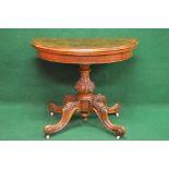 Victorian walnut demi lune card table the top folding over to reveal green baize playing surface,