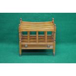 Late 20th century yew wood three section Canterbury with turned finials and having single drawer