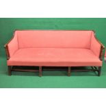 Georgian mahogany framed settee having upholstered back and arms with reeded frame and turned