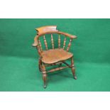 Traditional style elm seated captains chair with turned spindle back,