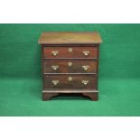 Miniature mahogany chest of drawers the top having reeded edge over three graduated drawers with