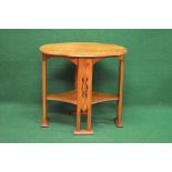 Oak Arts & Crafts style occasional table having shaped oval top with moulded edge supported on four