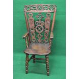 Country armchair having pierced carved back and top rail supported on moulded uprights leading to