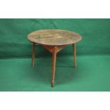 Circular elm cricket table having three plank top supported on three tapering legs - 34" in dia