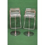 Pair of clear perspex seated high stools having adjustable heights and chrome frames,