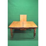 19th century pine topped wind out dining table the top being supported by four turned and reeded