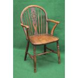 Wheel back elbow chair having swept arms and supported on turned stretchered legs