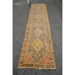 Blue ground carpet runner having reds and blue pattern - 142" x 33"