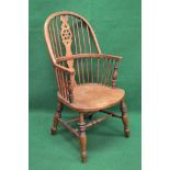 Elm seated wheel back Windsor chair the back being supported by spindles and back splats leading to