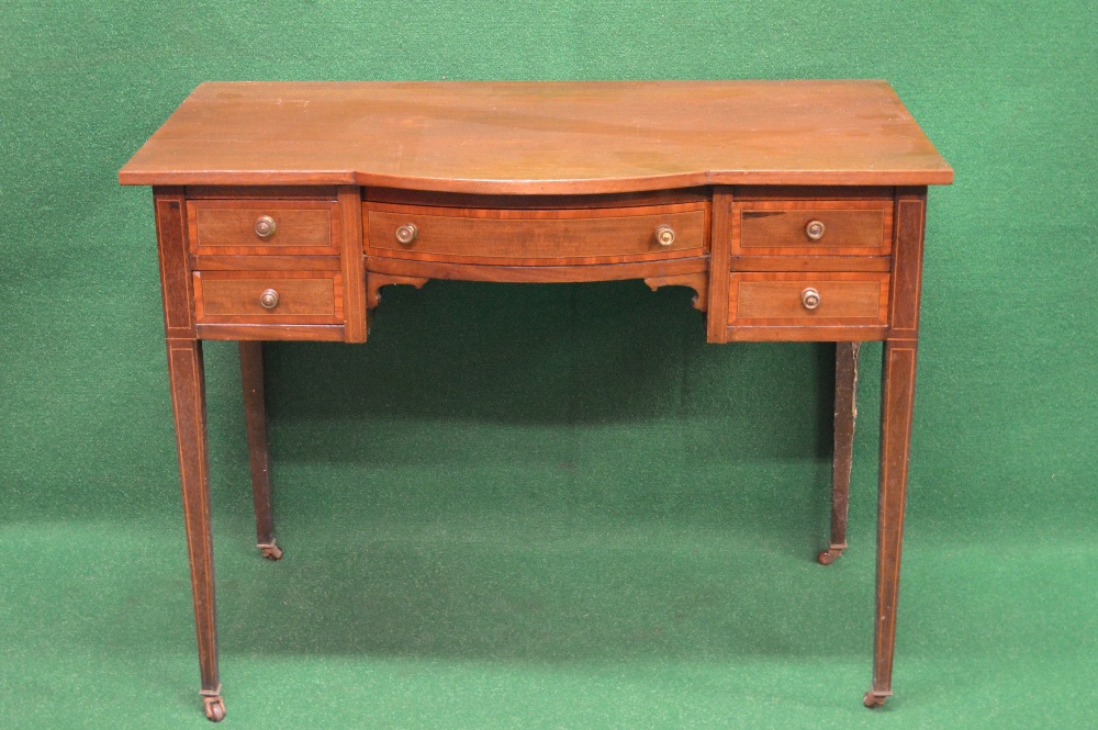 Edwardian mahogany cross banded writing desk having bow front over single central drawer flanked by