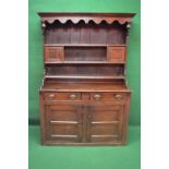 Late 18th/early 19th century period oak dresser having moulded cornice over shaped frieze and down