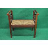 Late 20th century mahogany window seat having scrolled arms supported by X formed spindles and