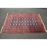 Red ground rug having blue,