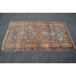 Rust ground patterned rug - 82" x 51"