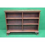 Mahogany double bookcase the top having moulded edge over four fixed shelves,