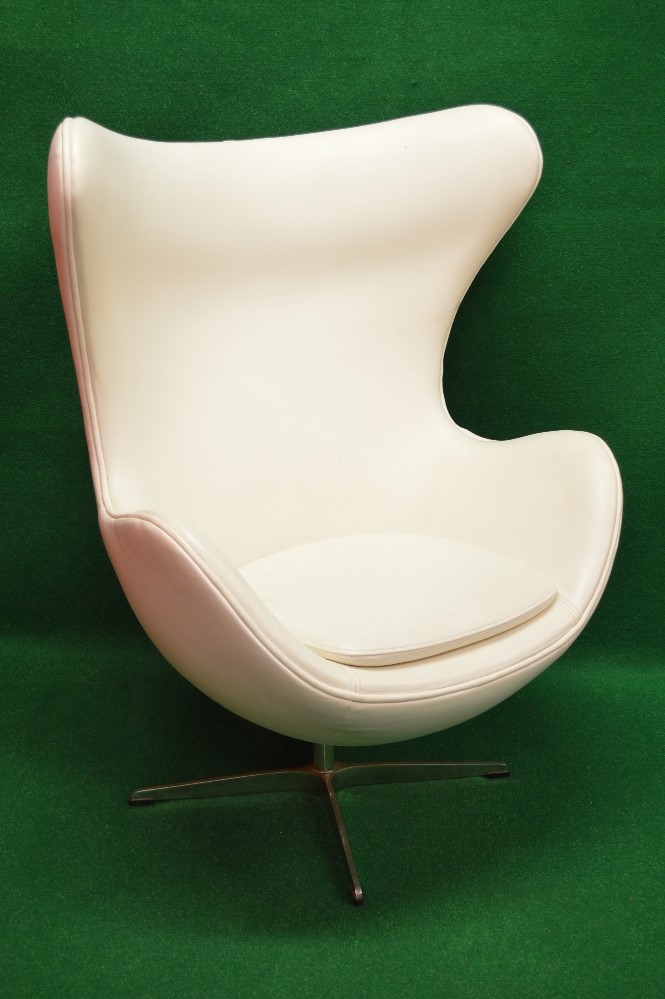 Mid century white leather rocking armchair having removable seat cushion,