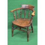 Elm seated captains chair having raised back and arms,