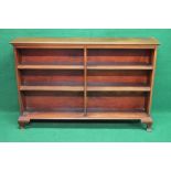 Mahogany double bookcase the top having moulded edge over four fixed shelves,