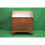 Georgian oak bureau having fall front opening to reveal drop well and fitted interior of drawers