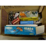 A collection of toys including a boxed power crane