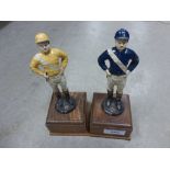 A pair of mid 20th century cast metal figures of horse racing jockeys, each mounted on a wooden