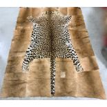 An African Kaross rug, with a leopard skin insert 197cm long & 188cm wide